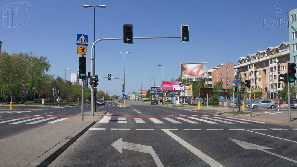 Sytuacja drogowa do pytania: Czy widoczny nad Twoim pasem ruchu sygnał świetlny zobowiązuje Cię do zatrzymania się przed sygnalizatorem?